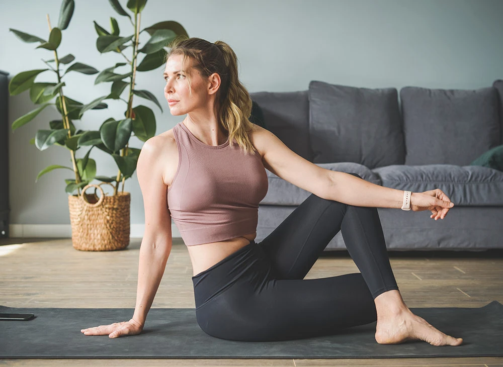 woman practicing yoga | Ottawa Plastic Surgery in Ottawa, Canada